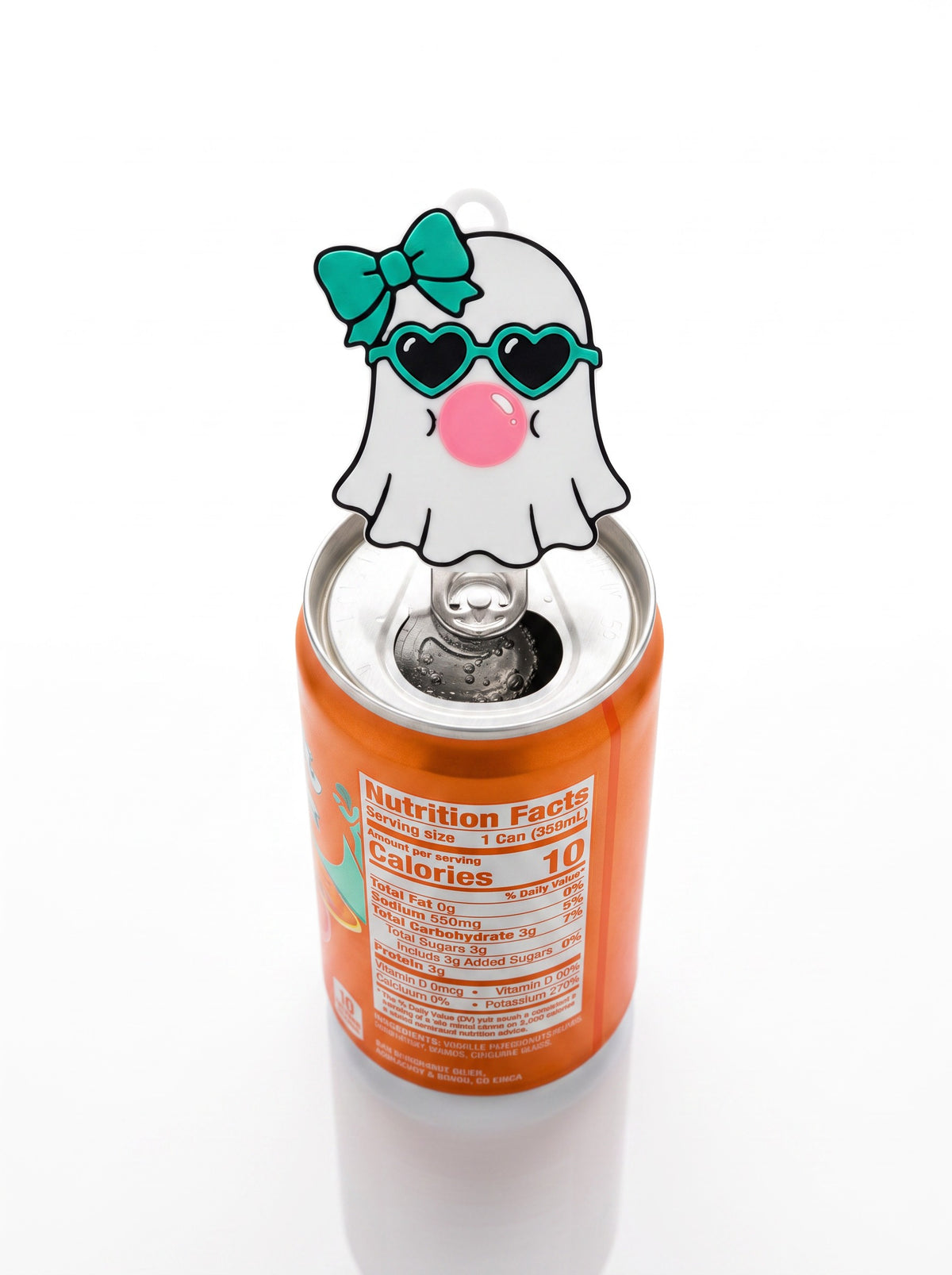 An orange beverage can with a novelty ghost-shaped pull tab on the lid. The ghost has a teal bow, black heart-shaped sunglasses, and a pink nose, photographed on a clean white background.
