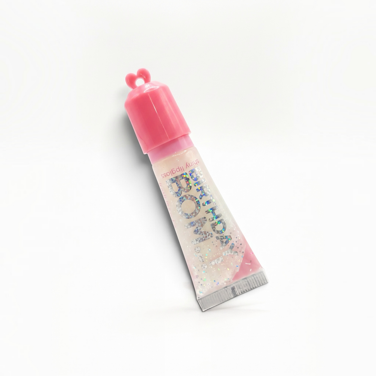 Pocket Magic shiny lip gloss in a clear tube with glitter and a pink heart-shaped cap against a white background