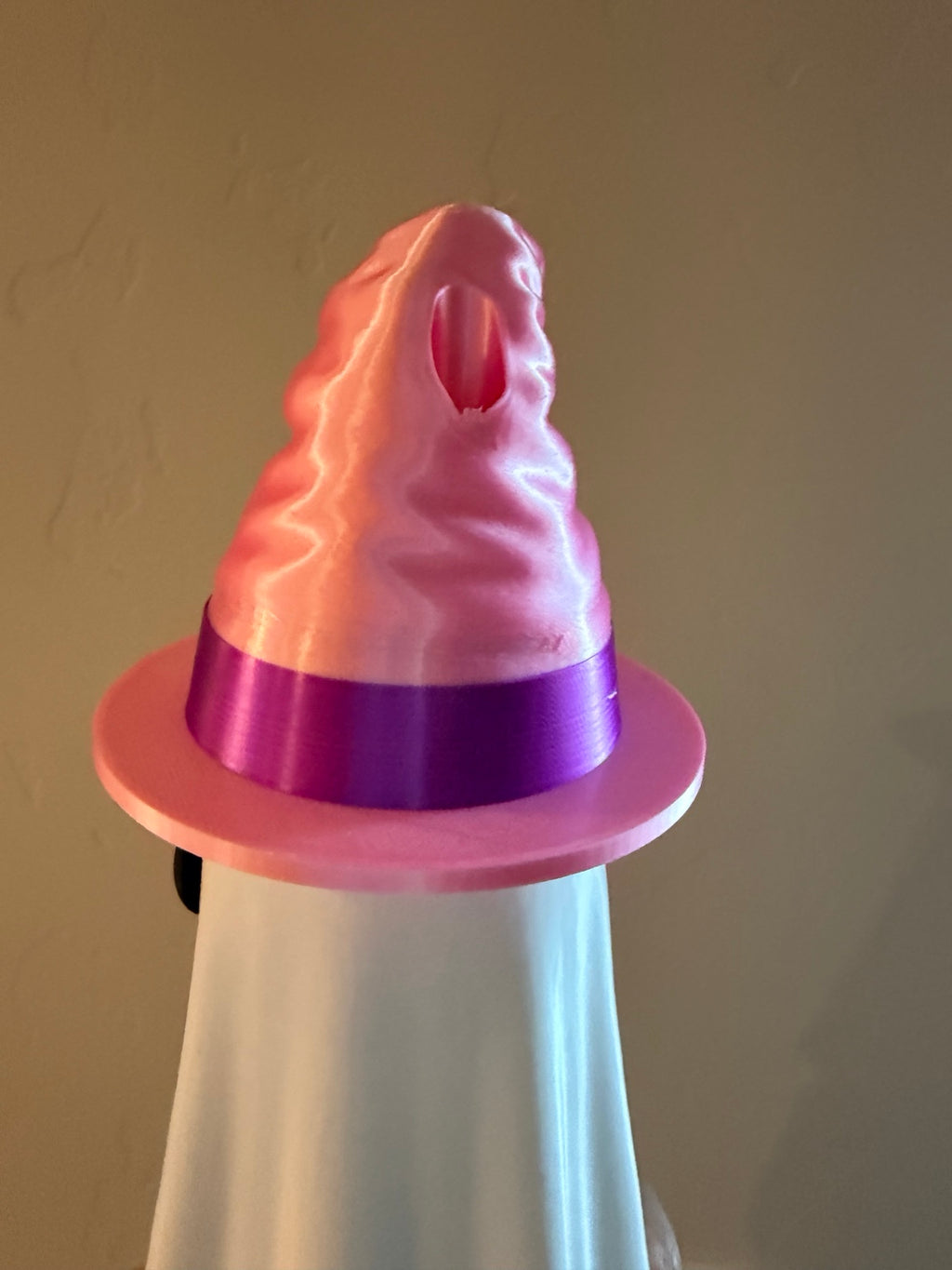 Close-up of removable pink and purple witch hat topper with straw opening for ghost can koozie